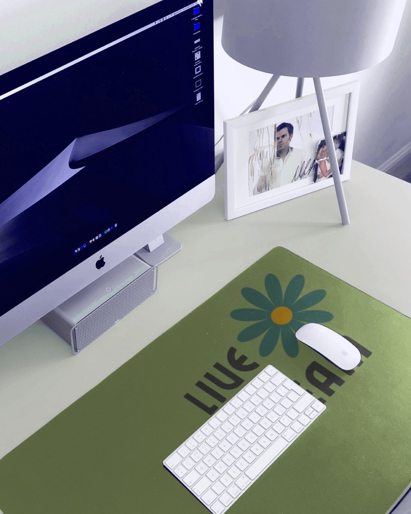 Large Gaming Pad Below Keyboard And Mouse With Photo Frame In Background