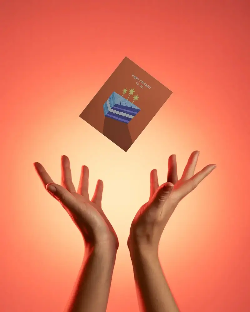 Hovering Greeting Card Mockup With Open Paired Hands On Smooth Gradient Background For Presentation