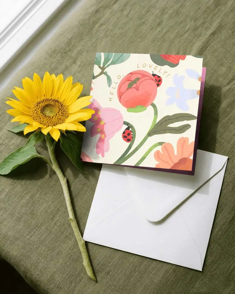 Blank Square Greeting Card With Envelope And Sunflower On Textured Fabric Background