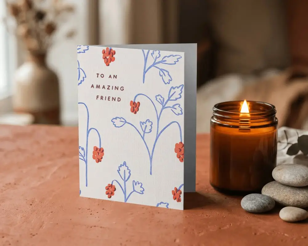Blank Greeting Card Mockup With Burned Candle And Stacked Stones For Design