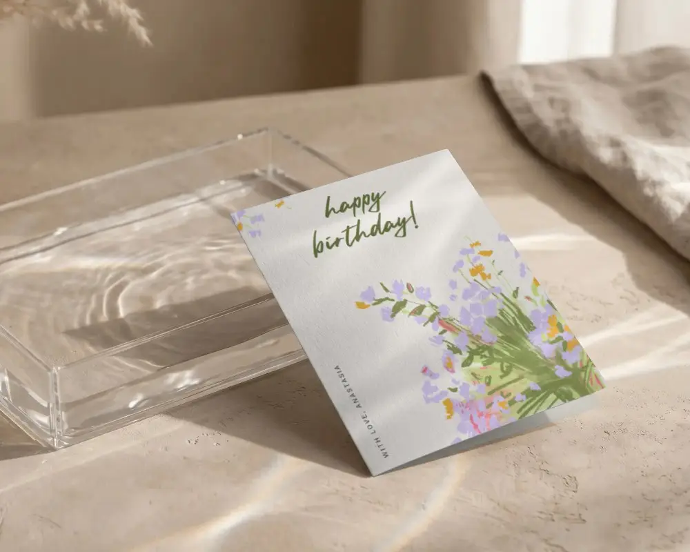 Blank Folded Greeting Card Mockup On Textured Surface With Light Reflections