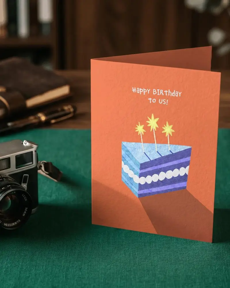 Standing Blank Greeting Card Mockup With Vintage Camera And Wooden Background