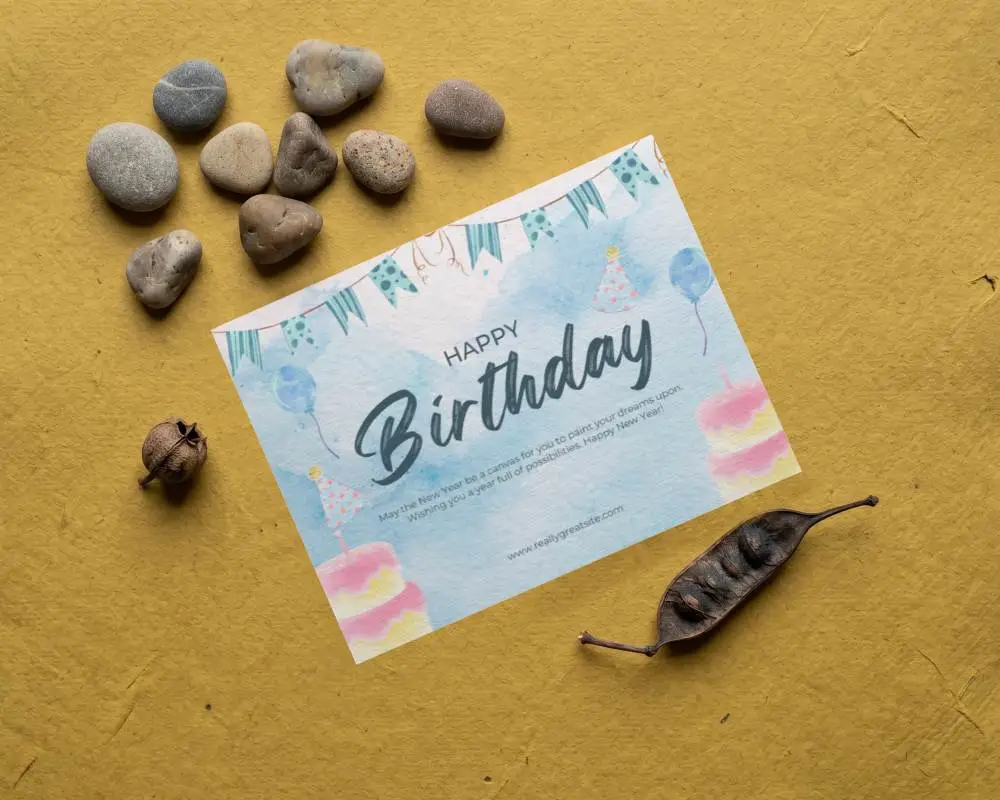 Natural Textured Paper Greeting Card Mockup With Stones And Dry Pod On Rough Background