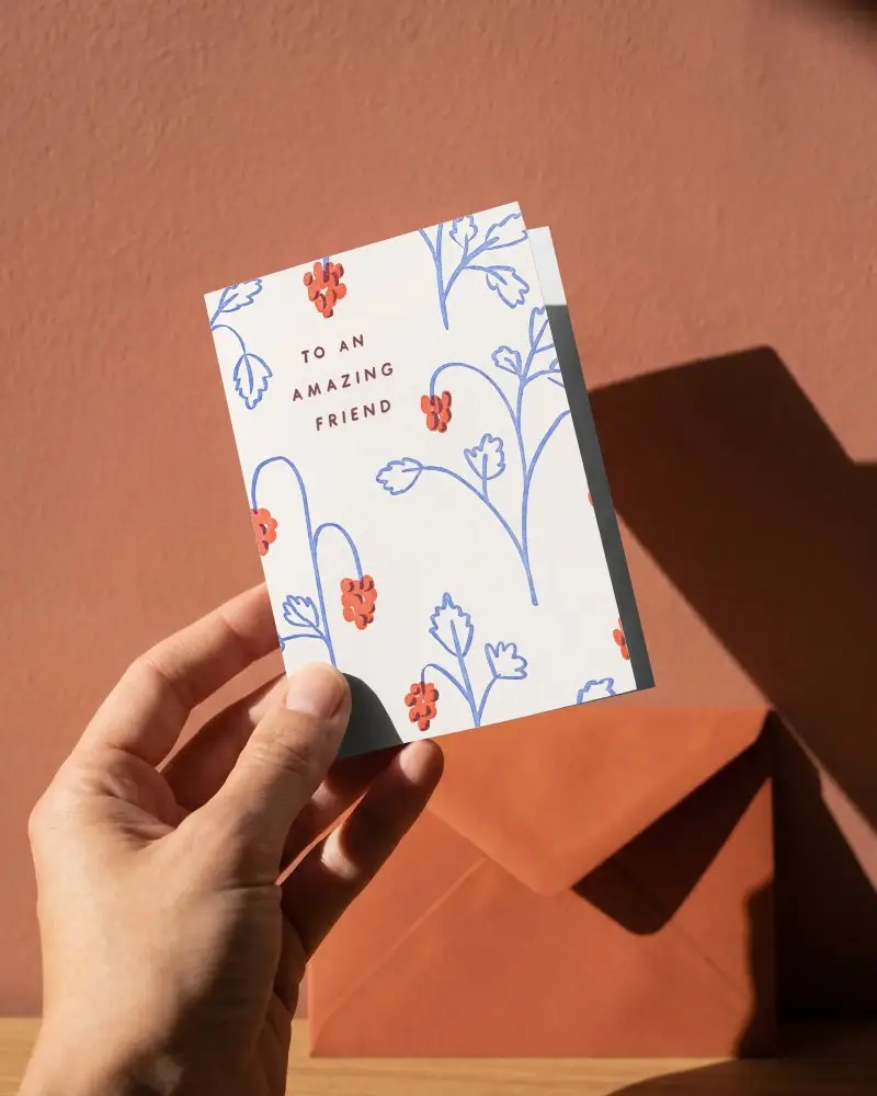 Hand Holding Minimalist Greeting Card Mockup With Envelop On Textured Background