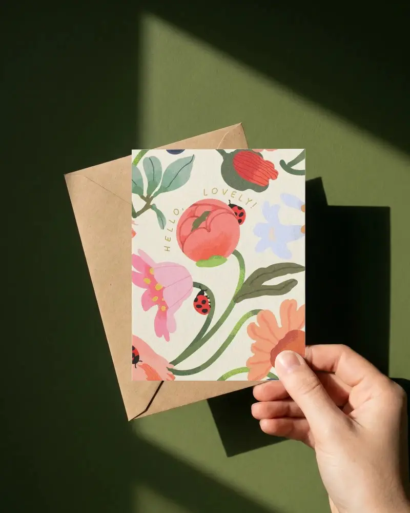 Realistic Greeting Card Mockup With Envelope And Hand On Solid Surface