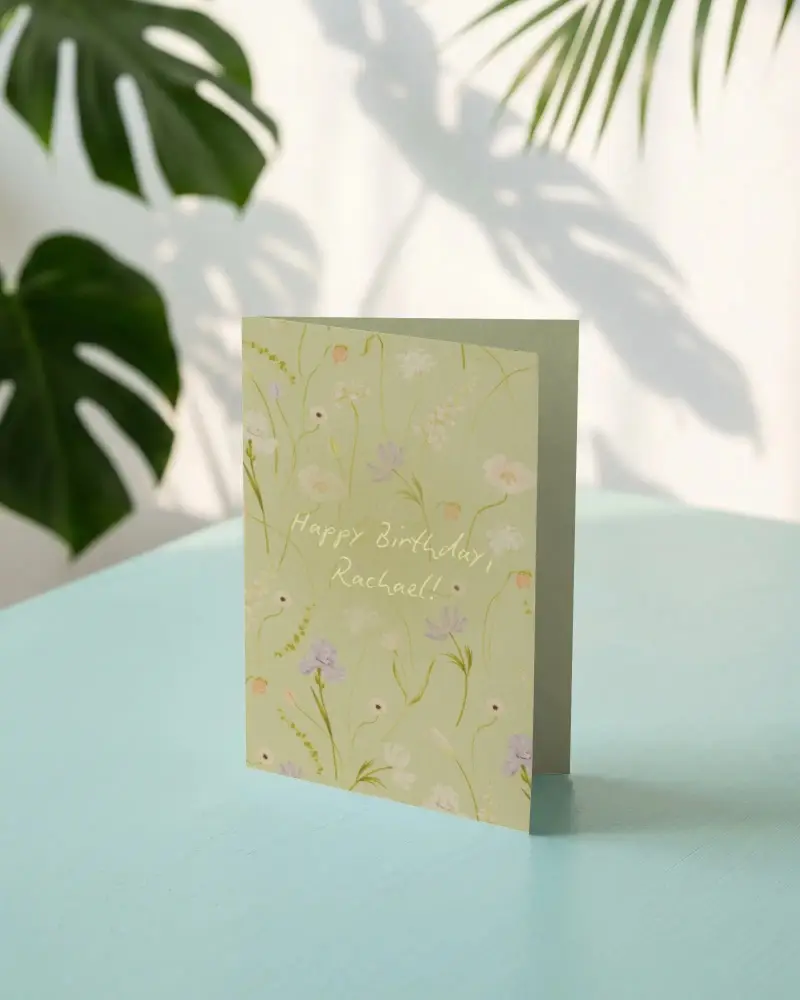 Folded Paper Greeting Card Mockup On Simple Table With Natural Leaf Shadows In Backdrop