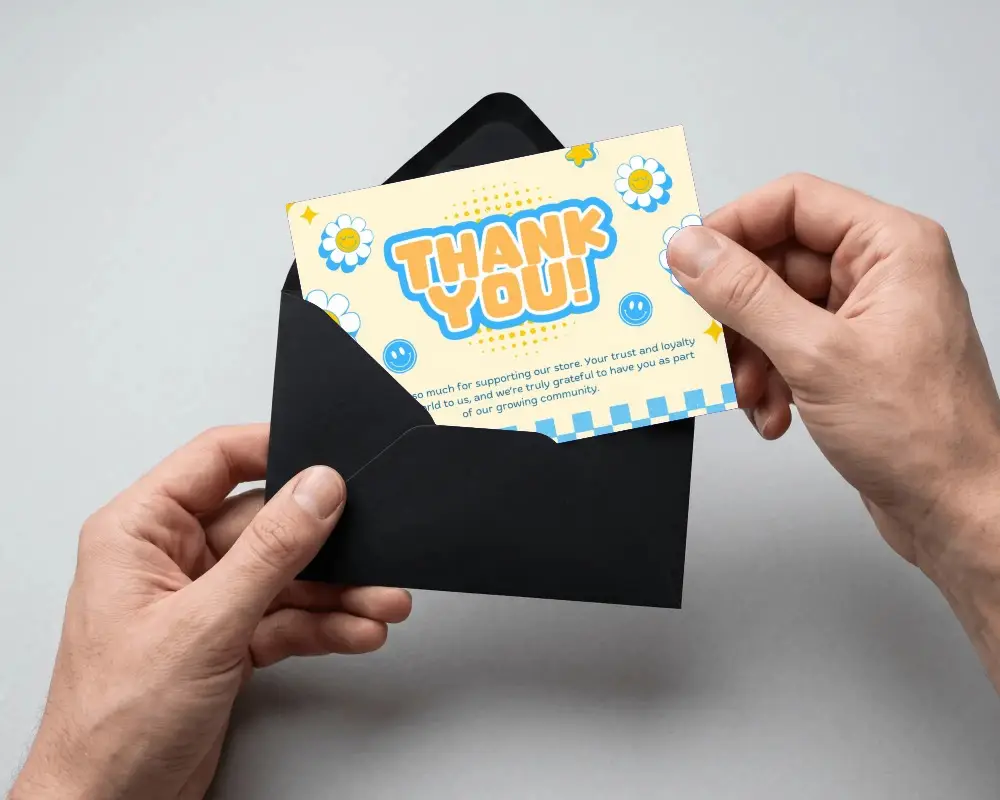 Elegant Greeting Card Mockup Showing Hands Inserting Card Into Black Envelope