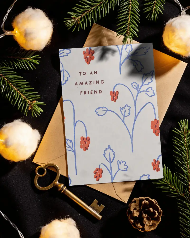 Holiday Greeting Card Mockup On Black Background With Vintage Brass Key Pinecone