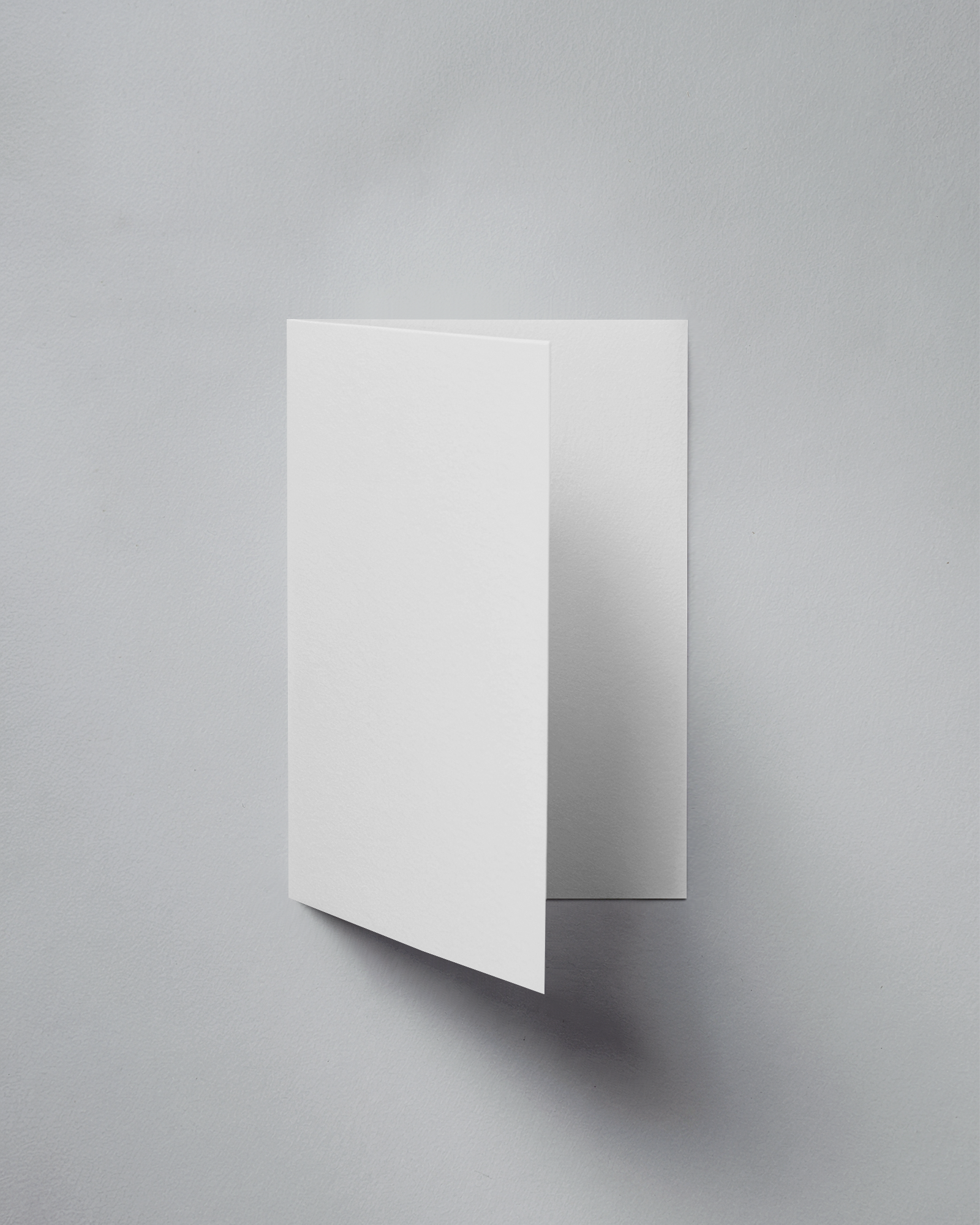 Minimalist Folded Greeting Card Mockup Floating On Light Grey Background Soft Shadows And Clean Design Layout