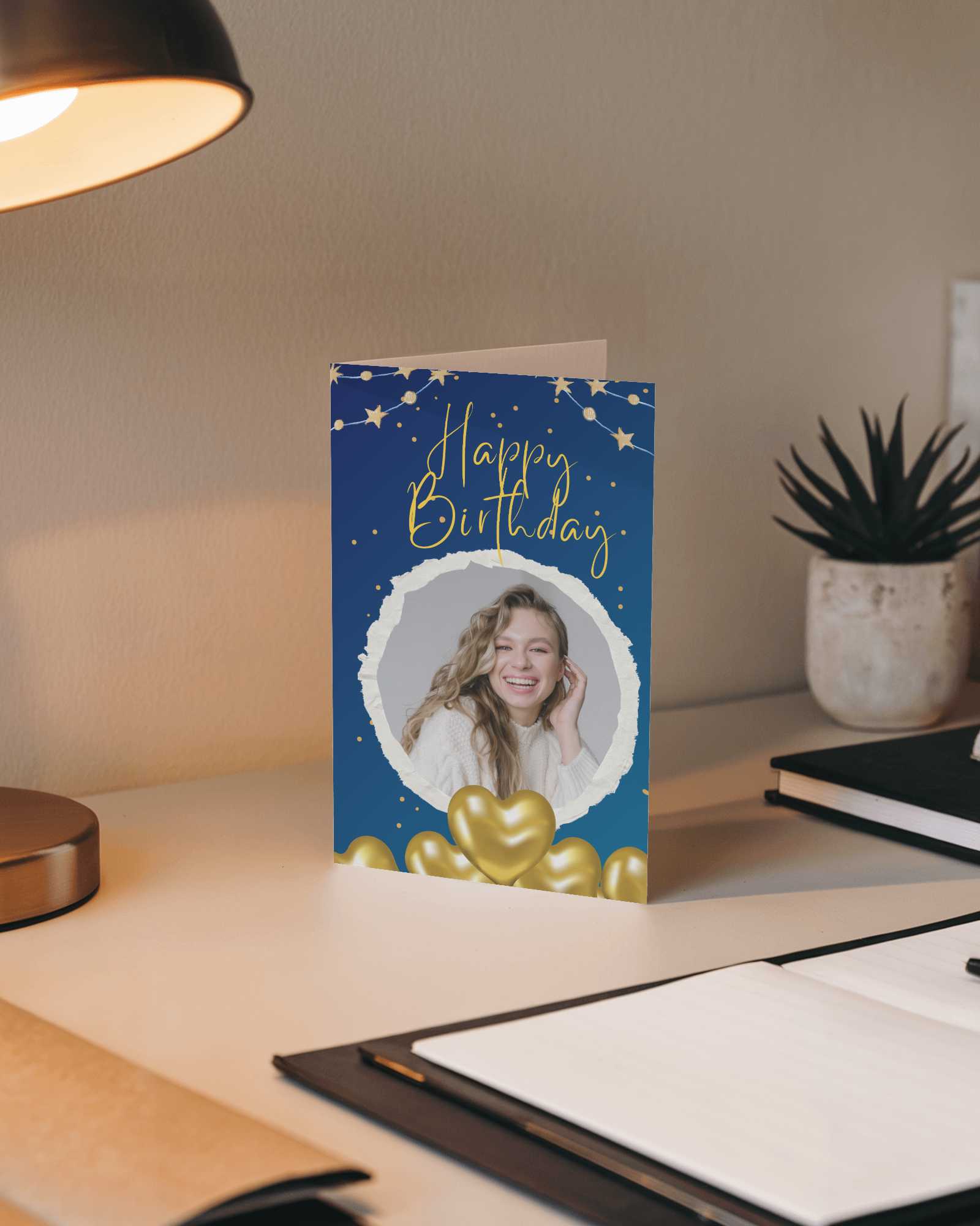 Standing Greeting Card Mockup On Modern Desk With Warm Lamp Light Notebooks And Succulent Cozy Workspace Vibe