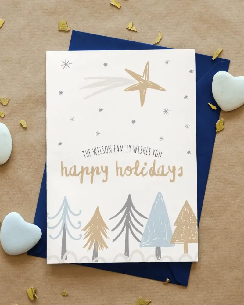 Greeting Card On Sand Paper With Heart Shaped Stones Lying Beside 14