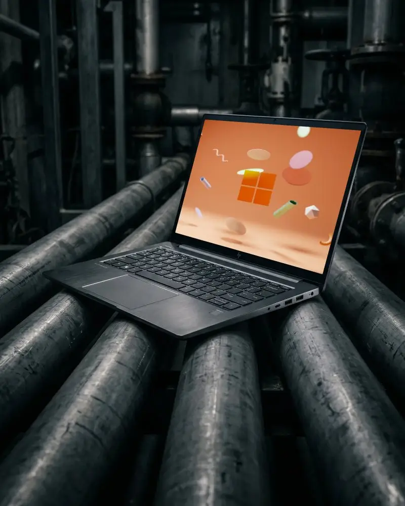 Sleek Modern Laptop Mockup On Industrial Rollers For Technology And Software Presentation