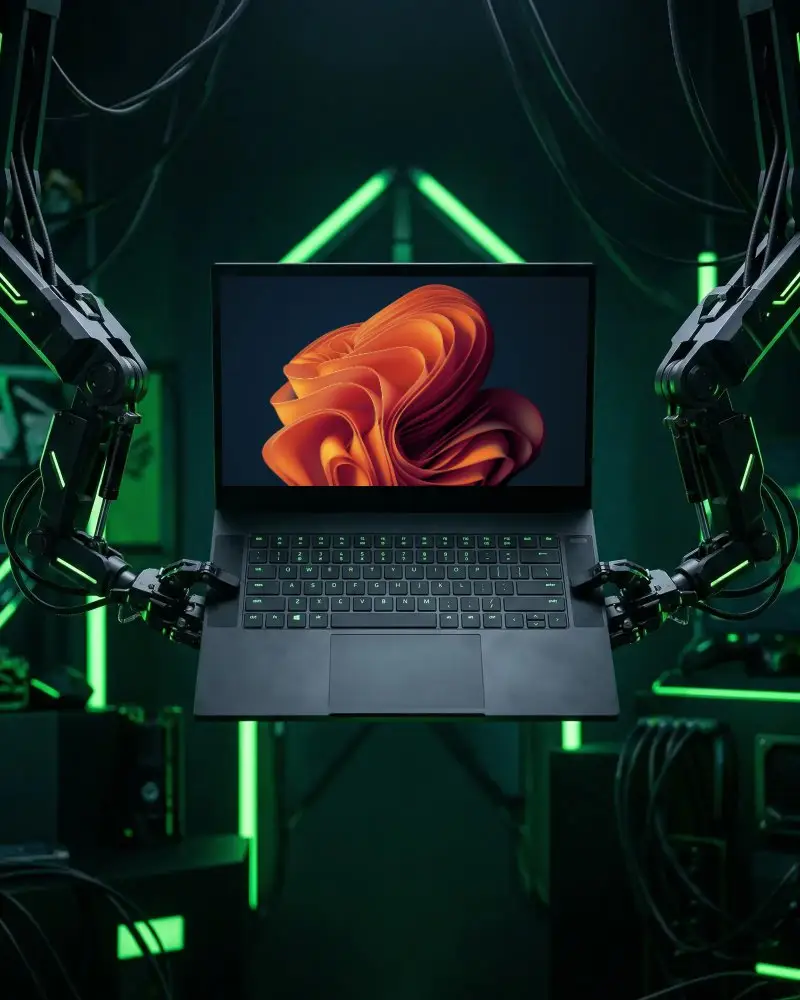 Modern Tech Razer Laptop Mockup Floating Held By Robotic Arms In Hightech Neon Setup