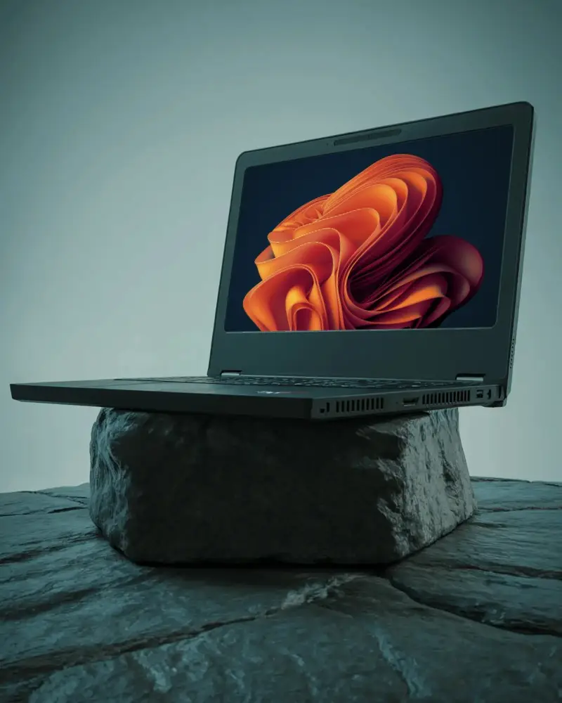 Modern Dell Laptop Mockup Angled View With Black Screen Standing On Rock Surface Minimalist