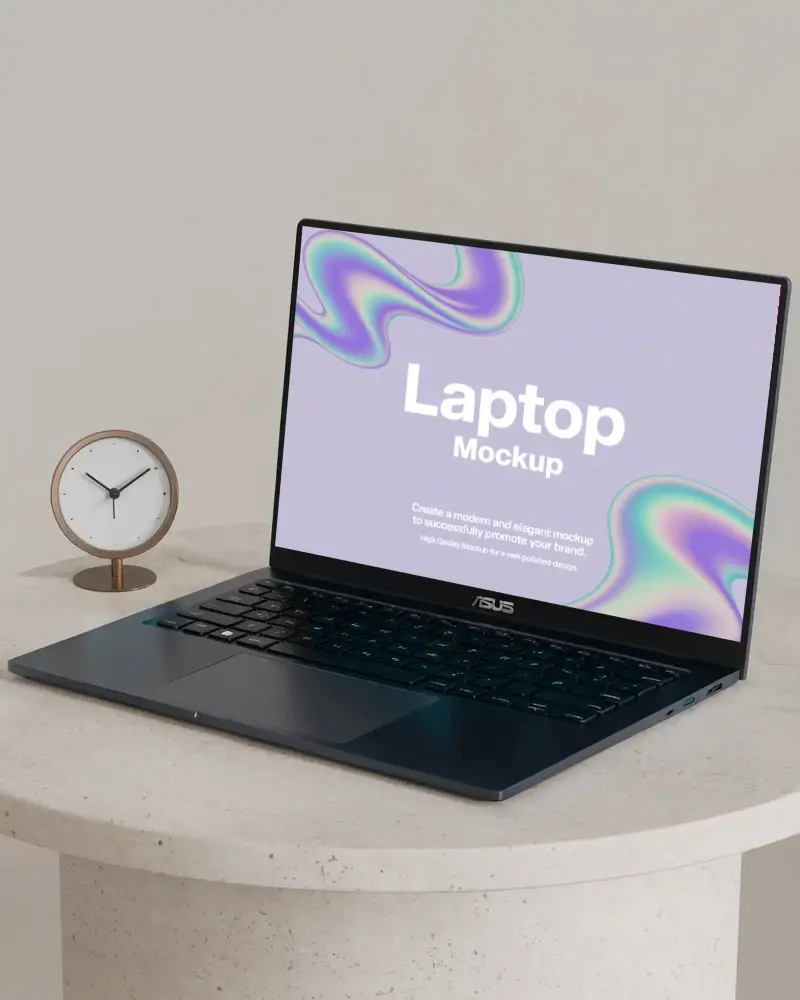 modern-laptop-mockup-on-round-table-with-minimalist-clock-in-studio-setting