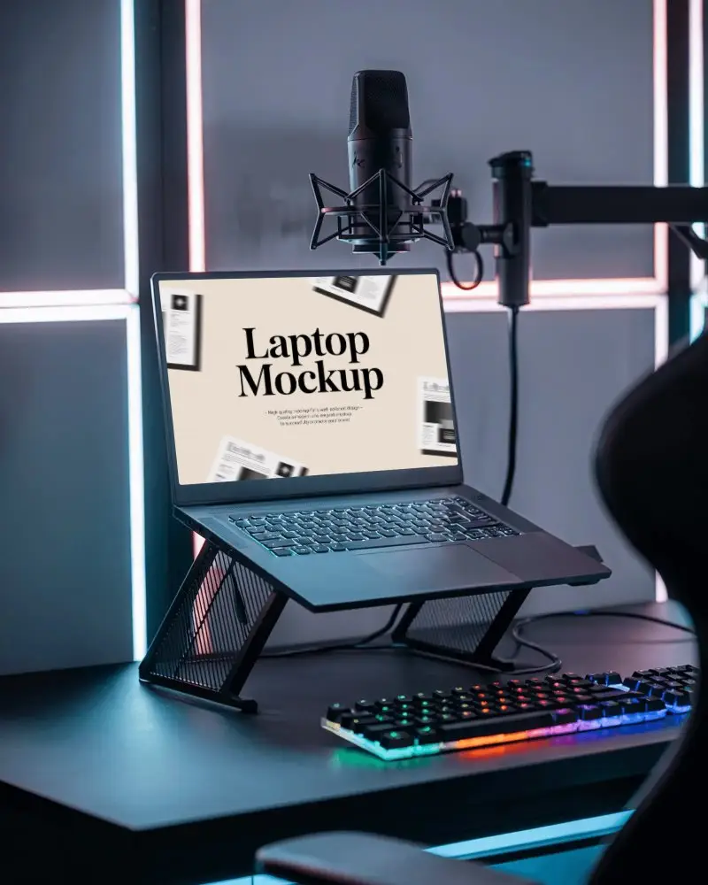 rgb-lit-streaming-setup-laptop-mockup-on-stand-with-gaming-keyboard-and-studio-microphone