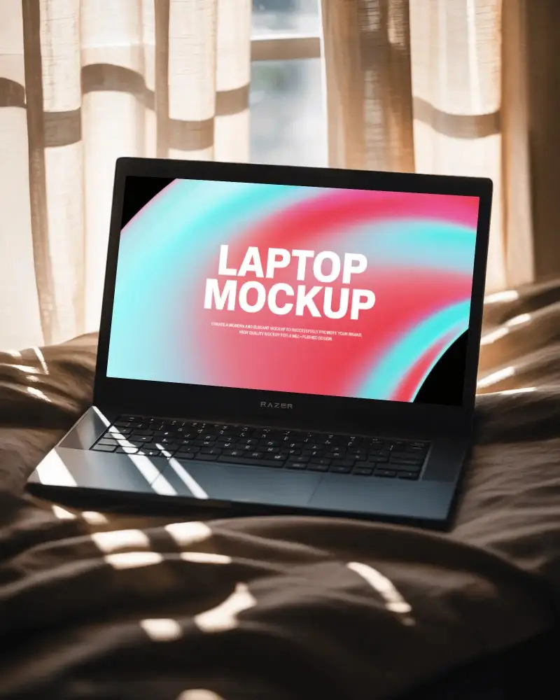 razer-laptop-mockup-on-bed-with-soft-sunlight-streaming-through-curtains-cozy-scene