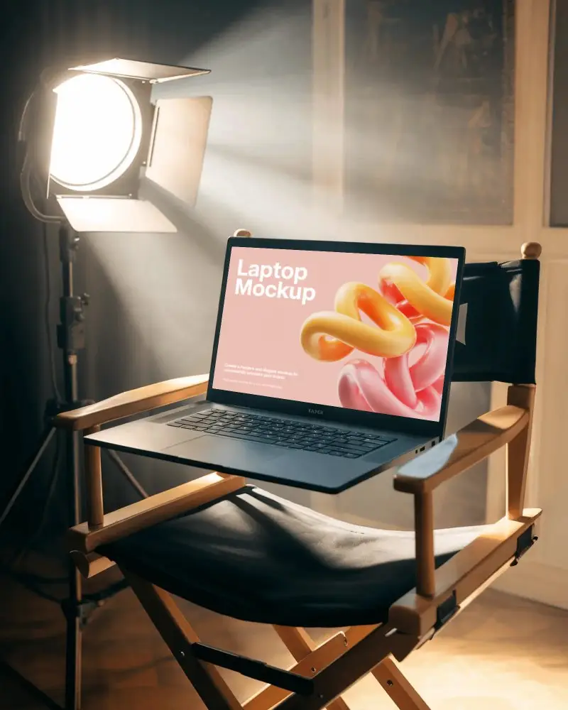modern-razer-gaming-laptop-mockup-digital-device-on-directors-chair-under-spotlight-in-studio