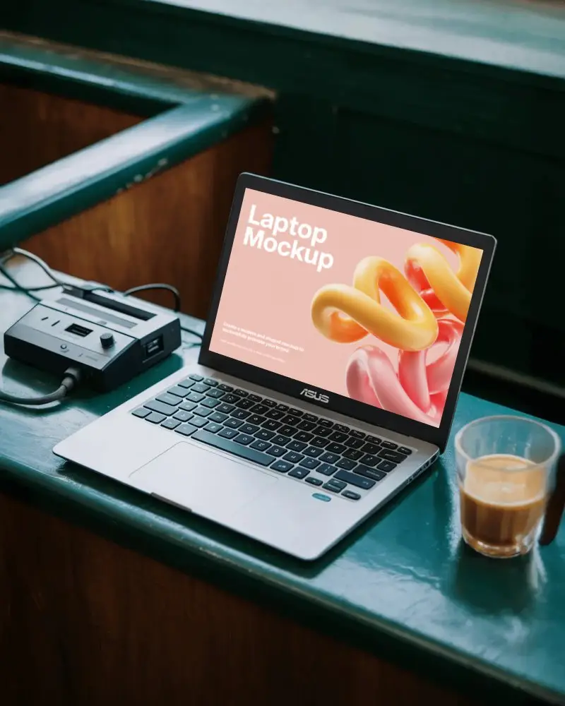 Casual Asus Laptop Mockup Workspace Scene With Coffee Drink And Small Black Gadget