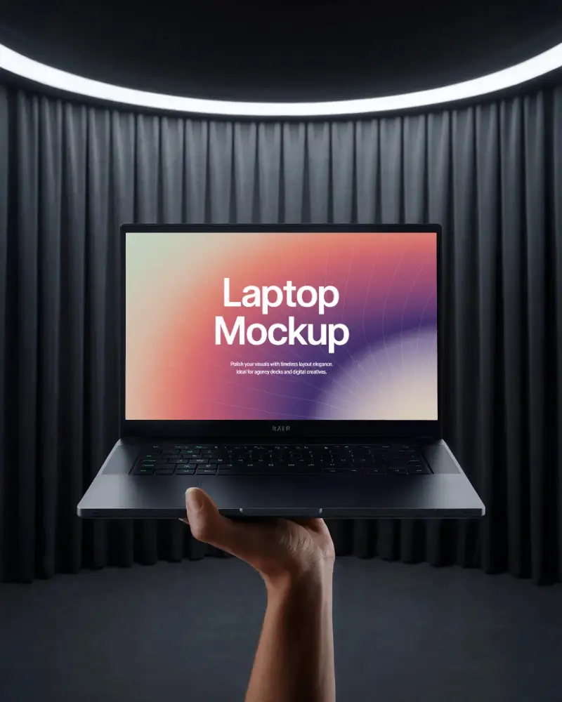 Razer Laptop Mockup Held By Hand In Modern Stage Setting With Dark Curtains And Light Ring
