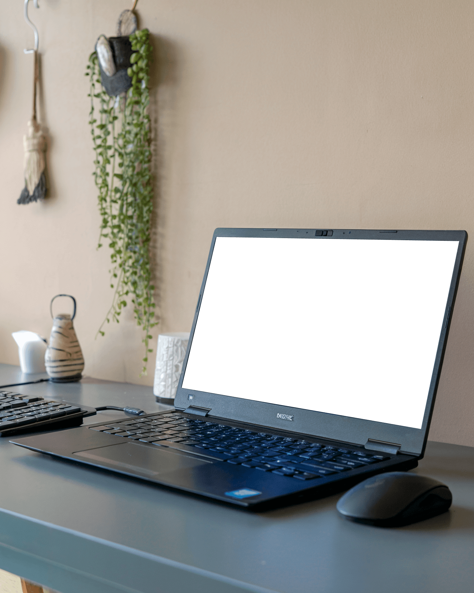 Modern Home Office Laptop Mockup Black Keyboard On Dark Grey Desk With Natural Light And Hanging Greenery 046