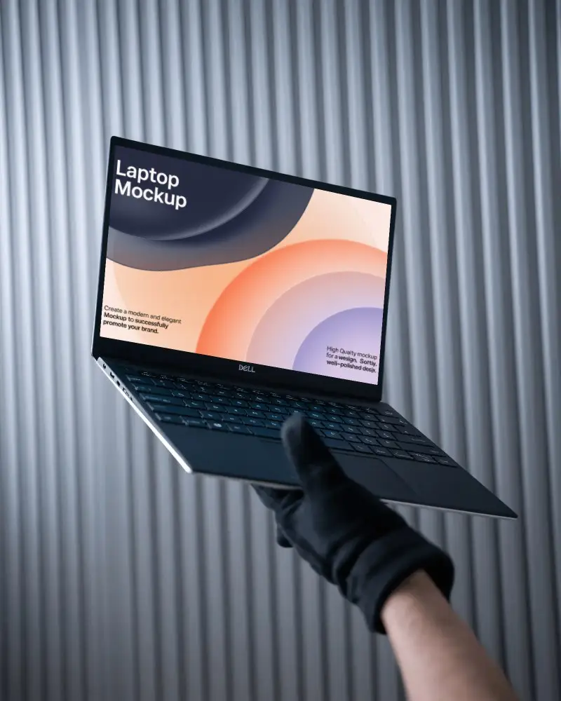 Dell Laptop Mockup Held By Gloved Hand Against Industrial Ribbed Metal Background In Modern Style