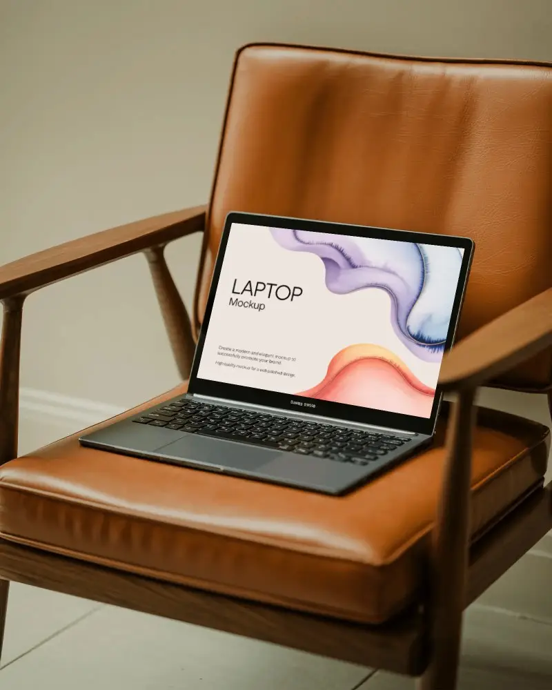 Samsung Laptop Mockup On Vintage Brown Leather Chair In Modern Home Office With Warm Natural Light