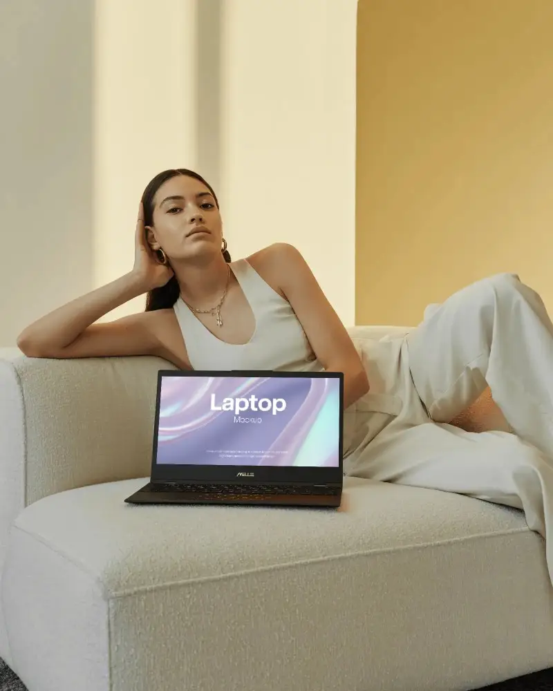 Asus Laptop Mockup On White Sofa With Woman In Elegant White Outfit In Modern Minimal Interior