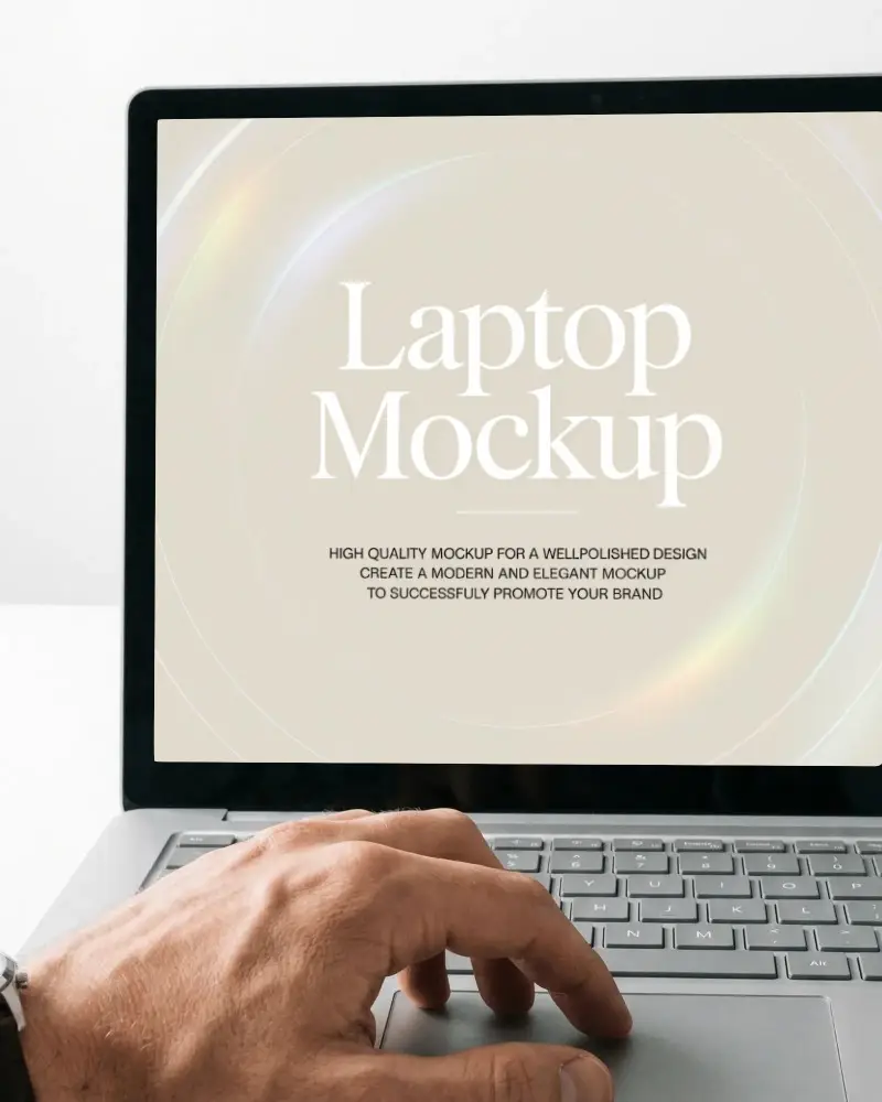 Close Up Laptop Screen Mockup With Hand Using Trackpad On Clean Desk