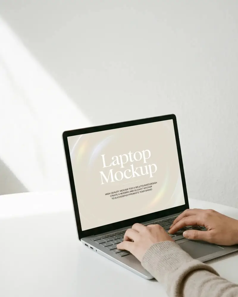 Minimal Angled Laptop Mockup With Typing Hands On Clean White Desk