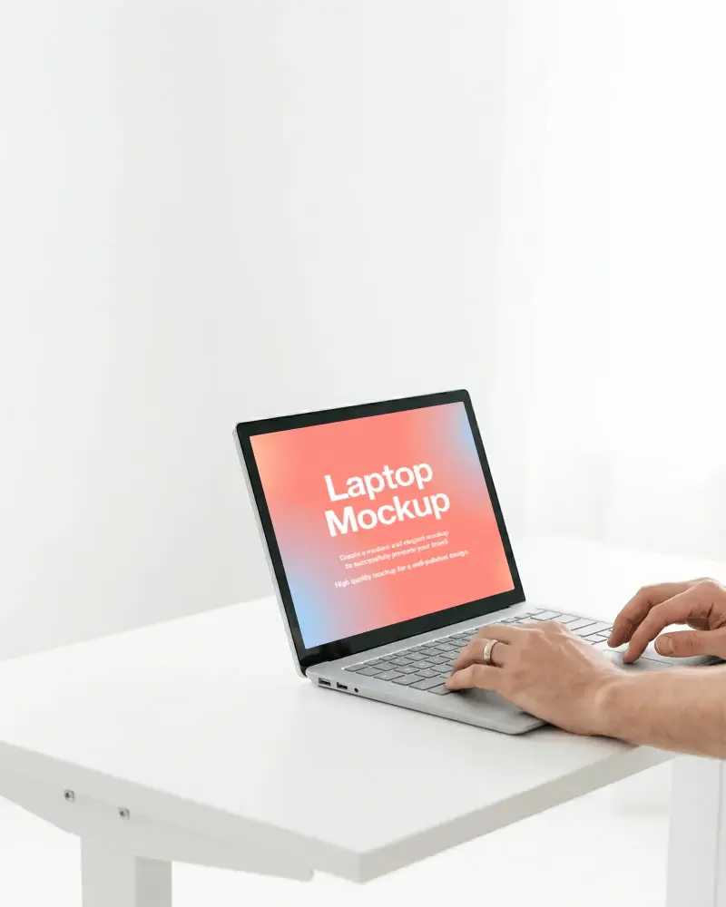 Minimal White Desk Laptop Mockup With Clean Angled Setup And Typing Hands