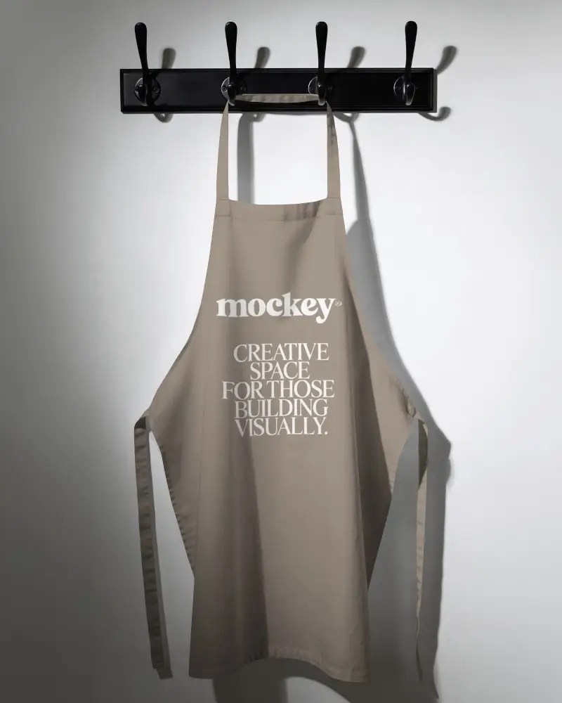 Gardener Apron Mockup Hanging On Multi Hook Rack Clean Wall Background Shadow Depth