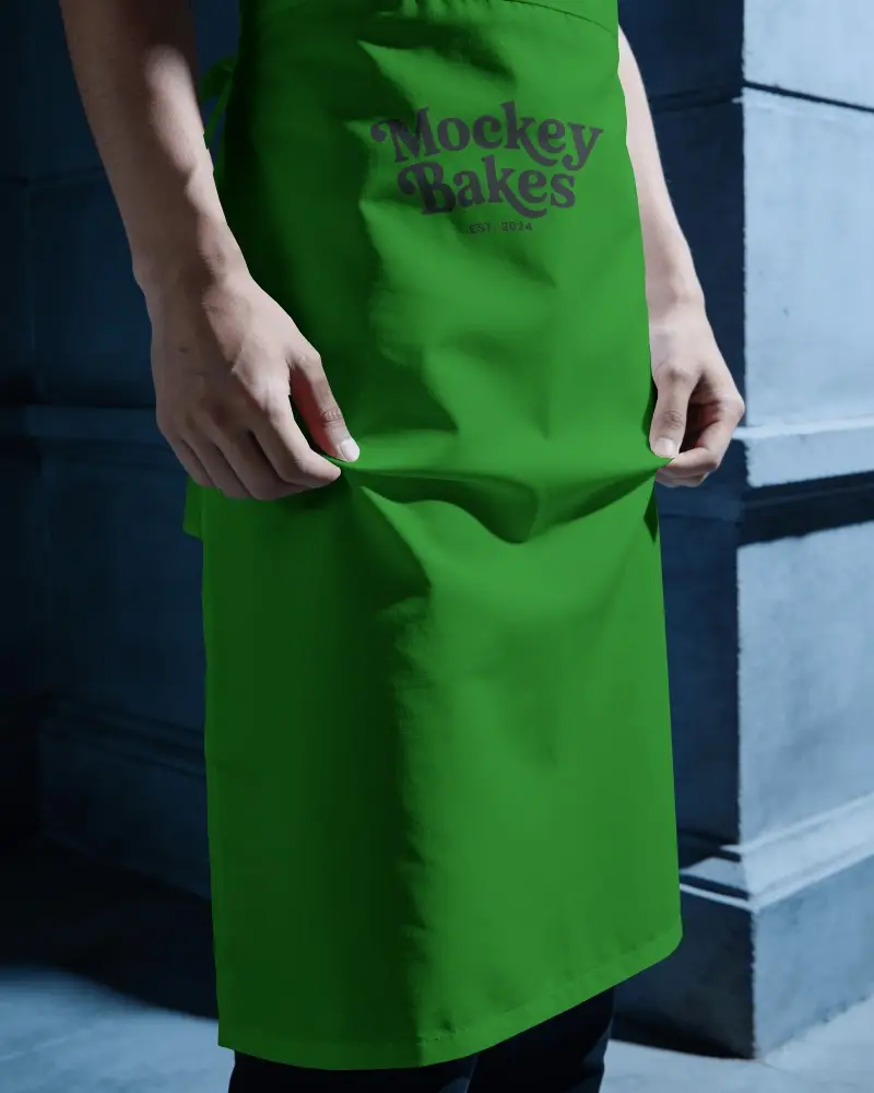 Dark Moody Waiter Apron Mockup With Hands Holding Fabric In Restaurant Style Lighting