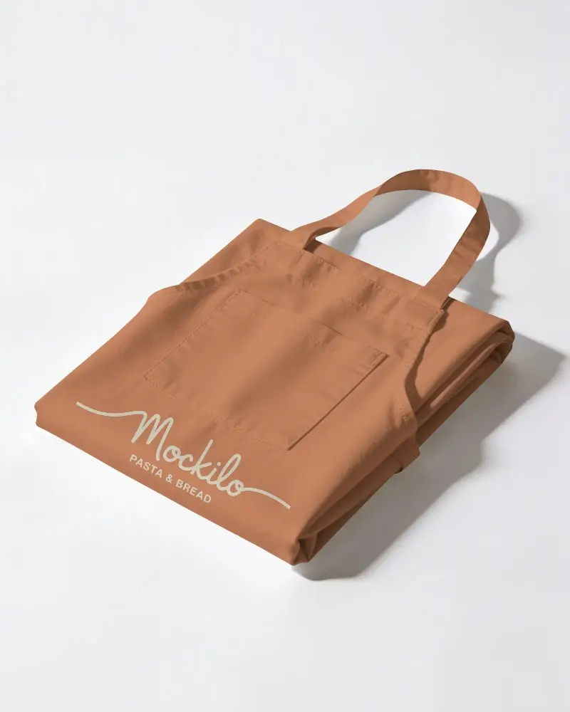 Durable Kitchen Apron Mockup Folded Flat With Clean Lines And Reinforced Stitching