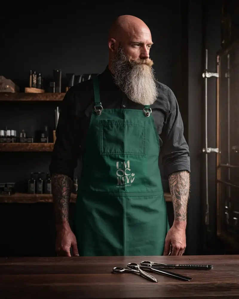 Professional Barber Apron Mockup With Adjustable Straps And Multiple Pockets For All Tools