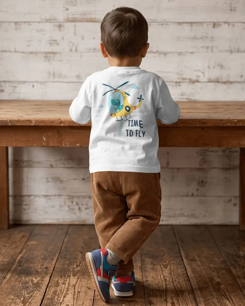 Baby Tee Mockup Back View Toddler Boy Standing By Rustic Wooden Table In Vintage Studio Room
