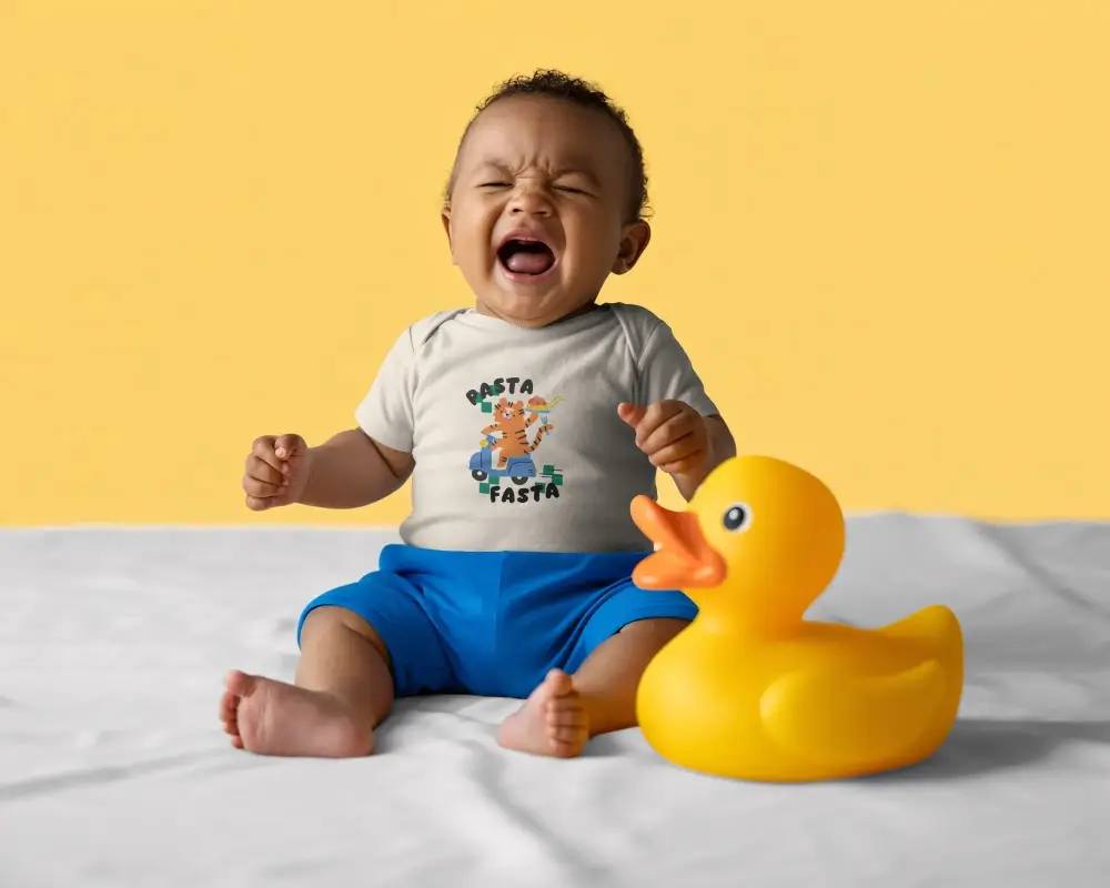 Adorable Baby In Relaxed Posture Showing Sleeve Detail Of Baby Tee Mockup Design