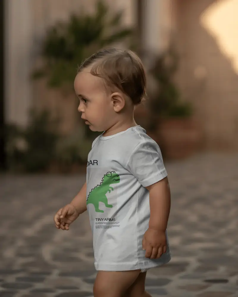Side Profile Walking Toddler Baby Tee Mockup Natural Lifestyle Pathway Background Soft Depth