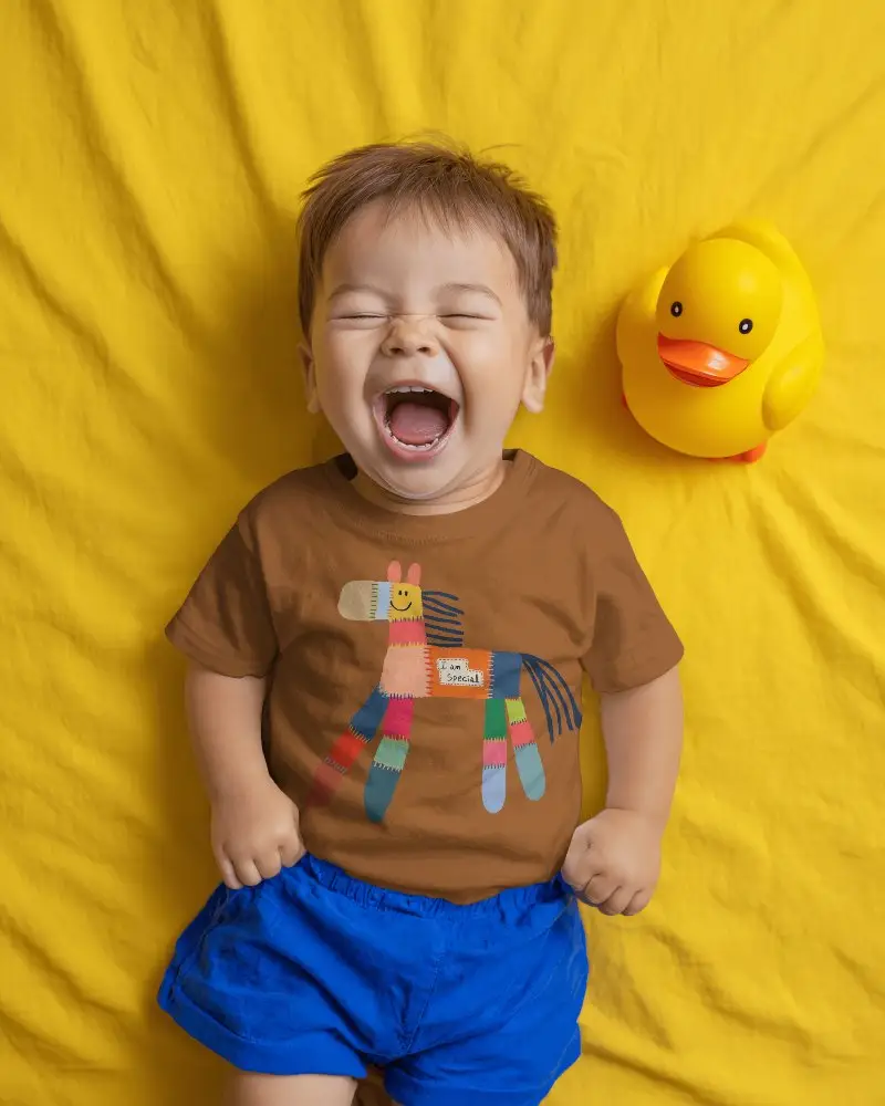 Adorable Baby Tee Mockup Laughing Toddler Lying On Soft Fabric Background