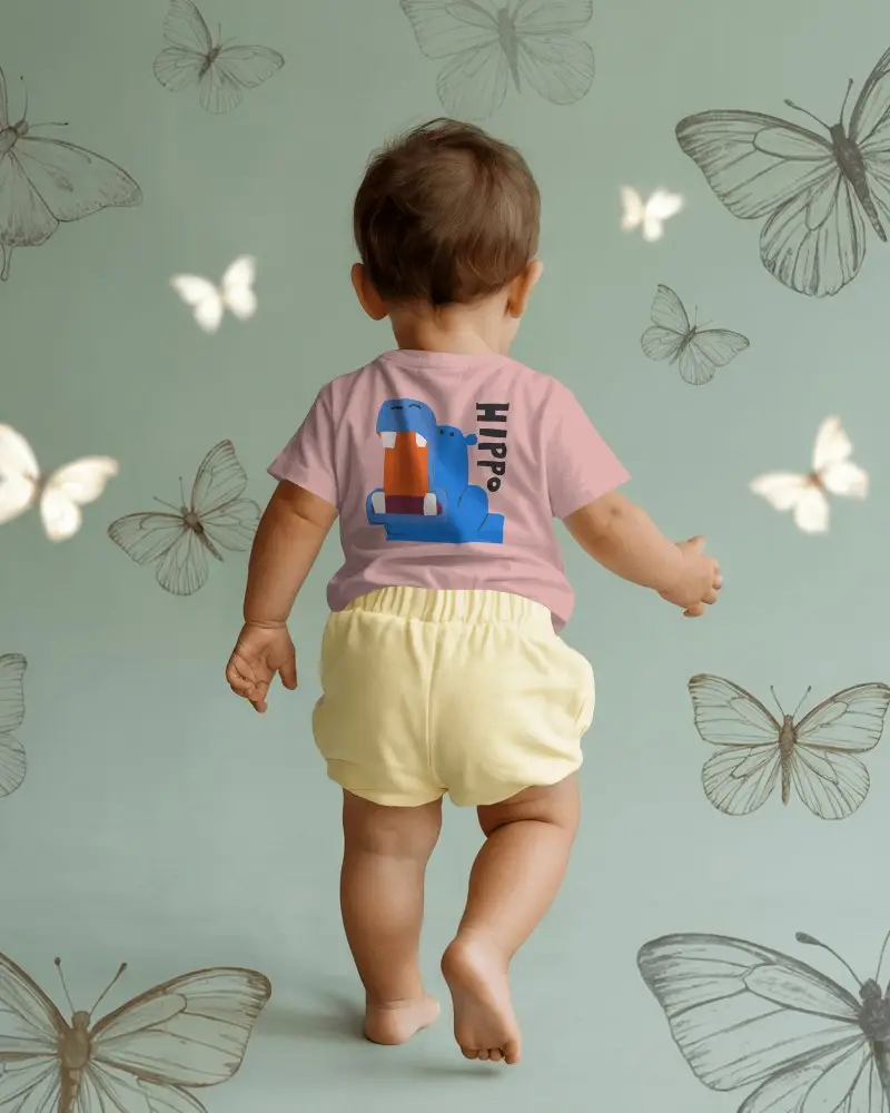 Baby Tee Mockup Back View Baby Wearing Tshirt Walking Toward Butterfly Illustrated Wall