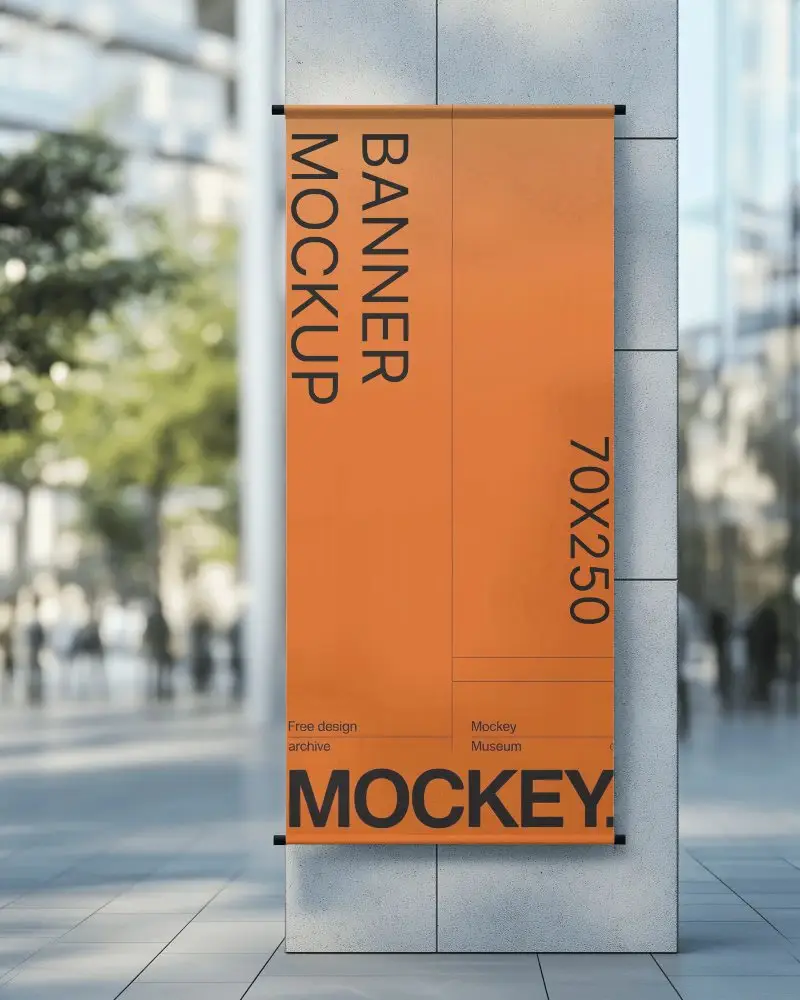 Vertical Wall Banner Mockup Mounted On Modern Building With Blurred Urban Background