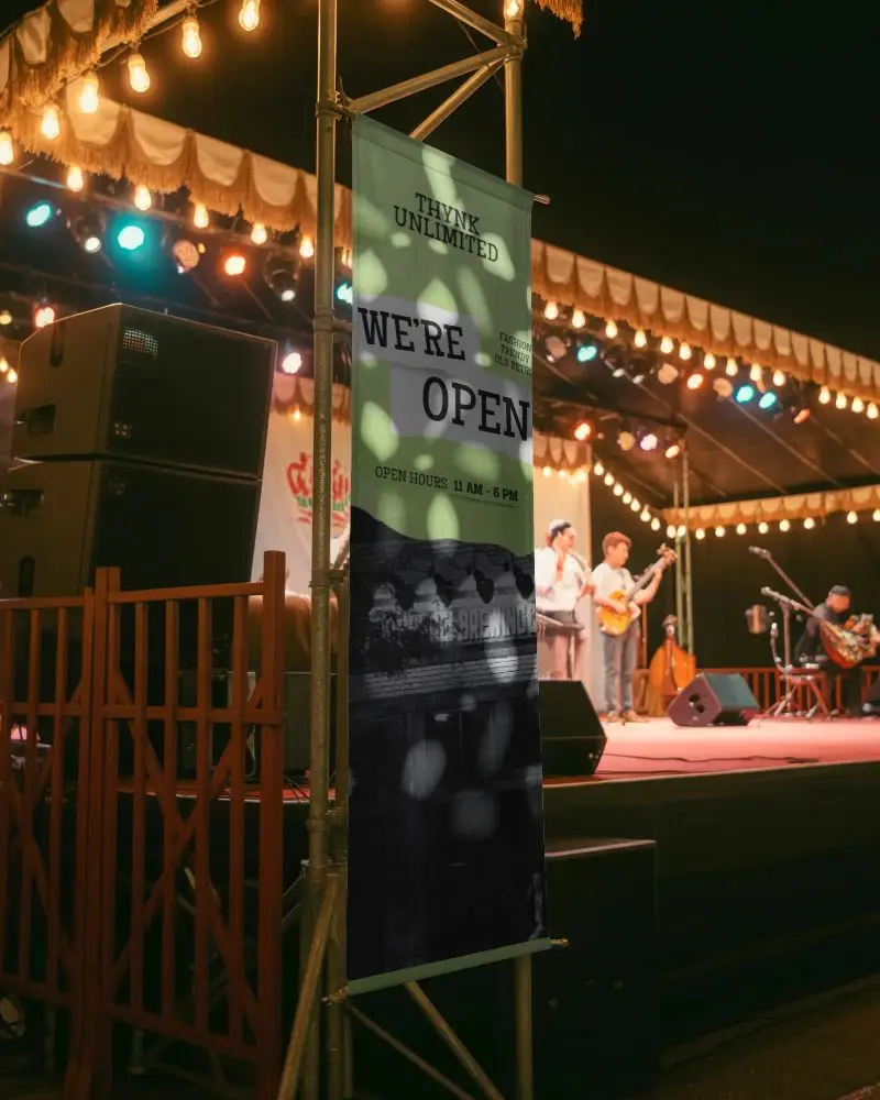 Vertical Banner Mockup For Event Promotion With Stage Speakers And Live Band Performance