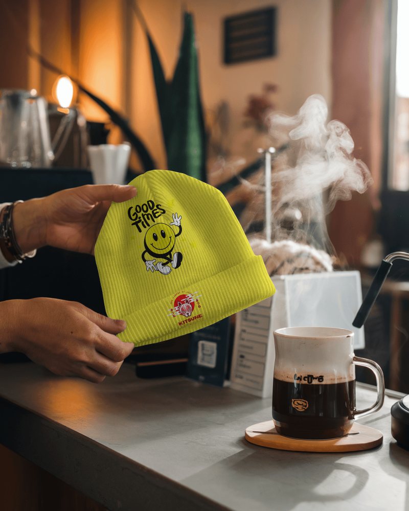 Good Vibes Beanie Mockup Neon Yellow Knit Hat With Happy Face Graphic Casual Cafe Setting With Warm Coffee Steam