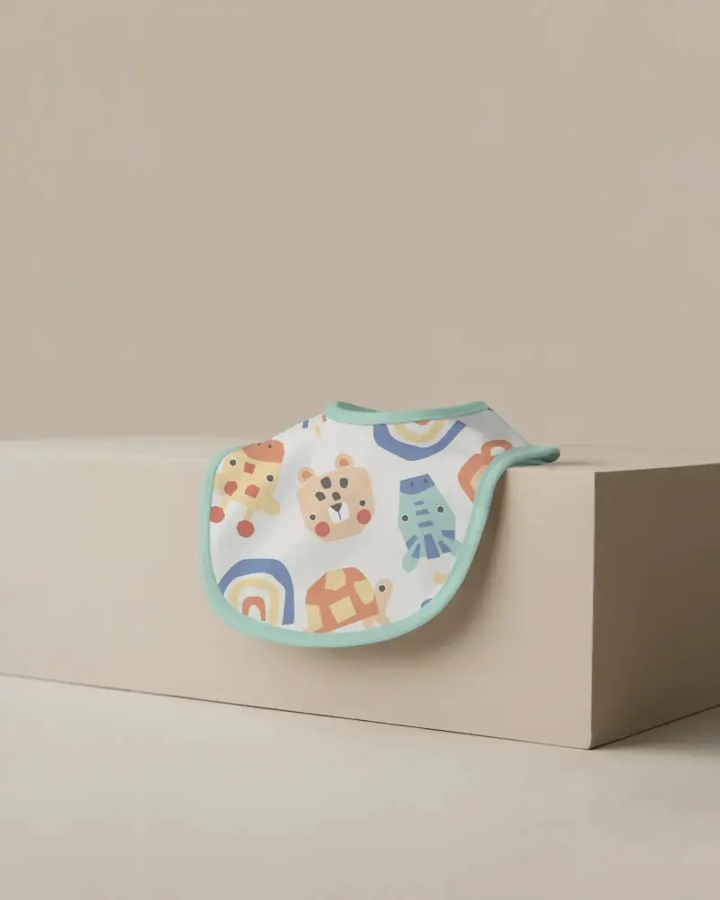 Premium Soft Baby Bib Mockup On Neutral Minimalist Surface Perfect For Branding