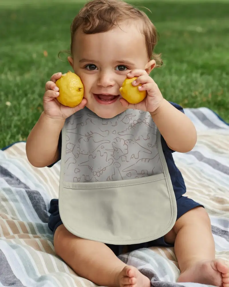 Cute Baby Wearing Waterproof Bib Mockup With Large Pocket For Easy Food Crumb Collection