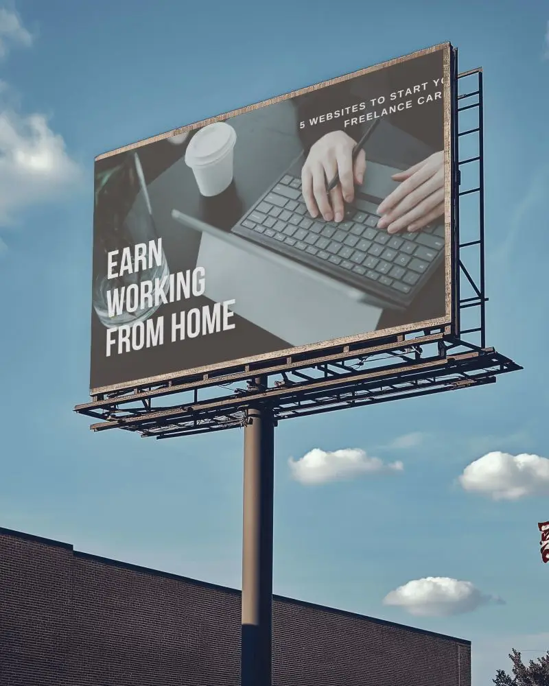 Elevated Billboard Mockup Under Sunny Sky With Buildings In View