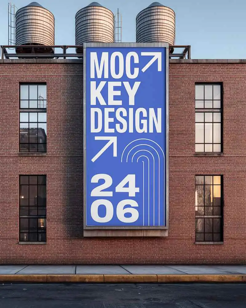 Vertical Billboard Mockup On Red Brick Wall With Water Tanks Industrial Setting