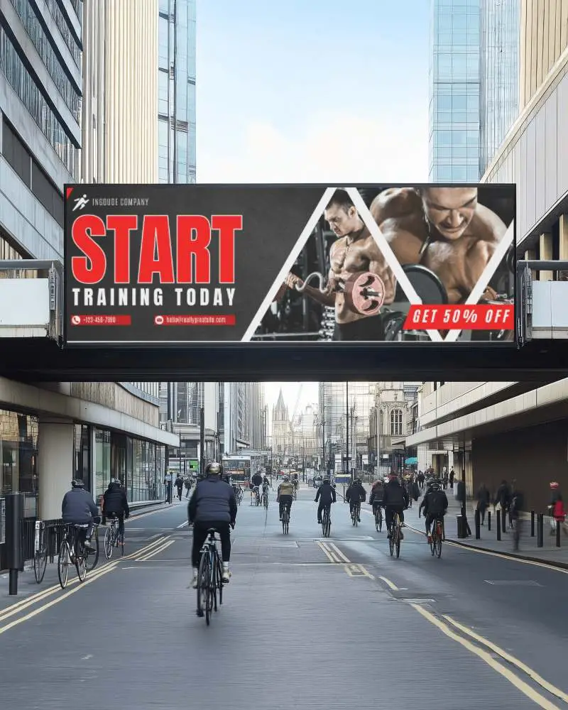 Urban Billboard Mockup Above Busy Road With Cyclists And Modern Buildings