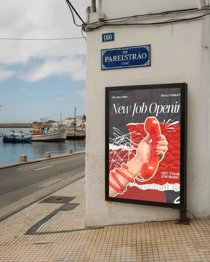coastal-street-billboard-mockup-on-white-wall-overlooking-harbor-and-docked-boats
