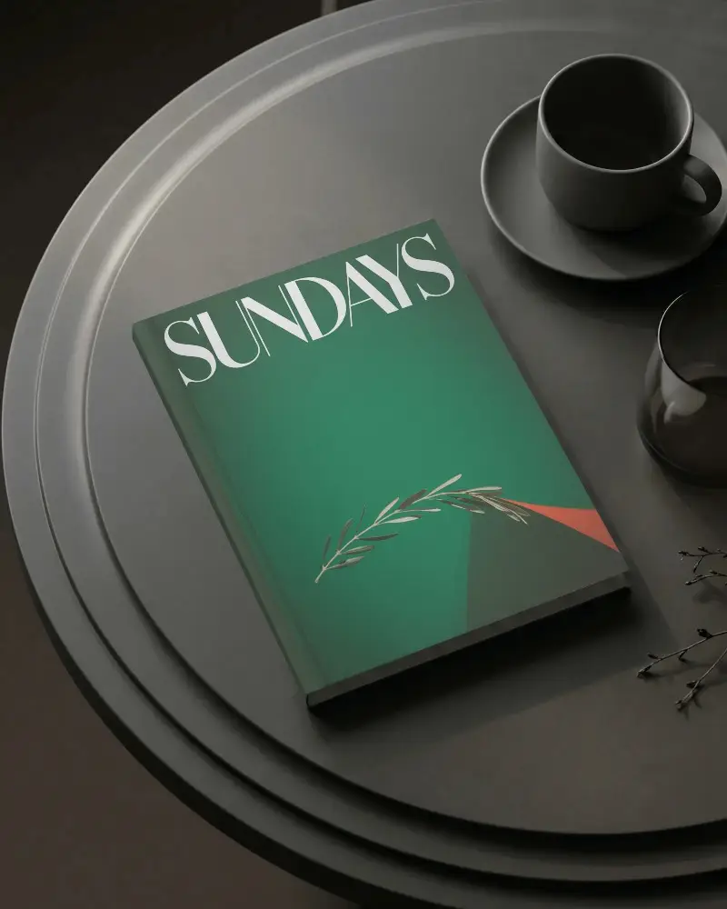 Blank Hardcover Book Mockup On Dark Minimalist Round Table With Cup And Glass Display
